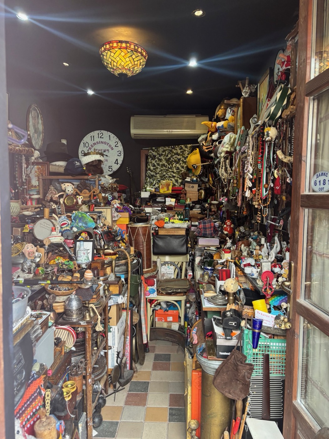 An antique shop crowded with clocks, cameras and curiosities
