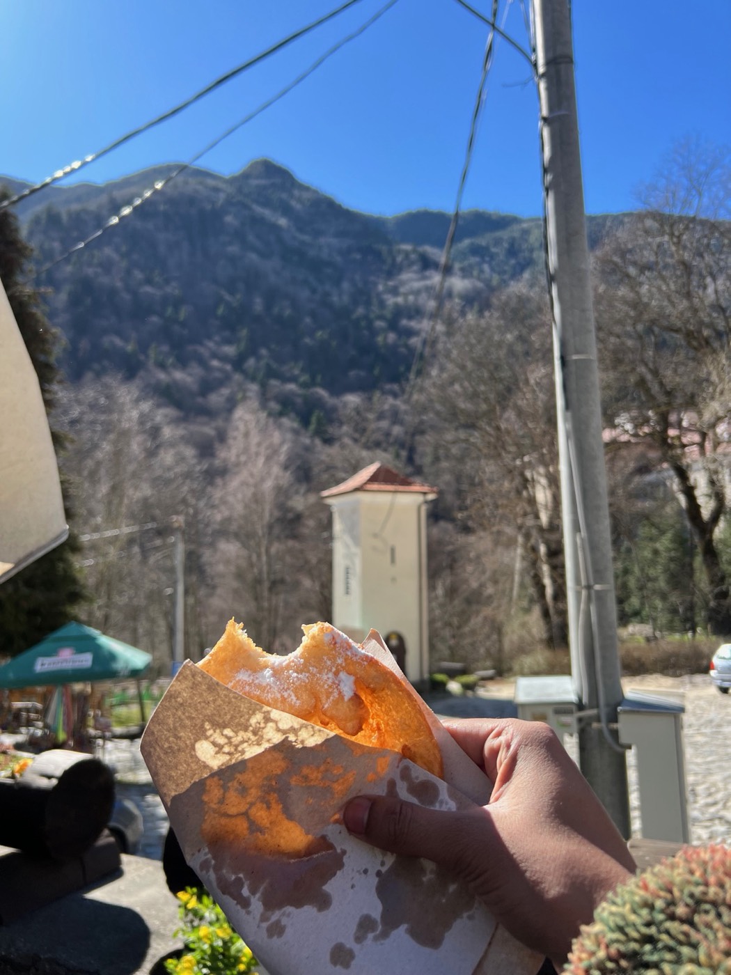 A snack held up against the Rila mountain view
