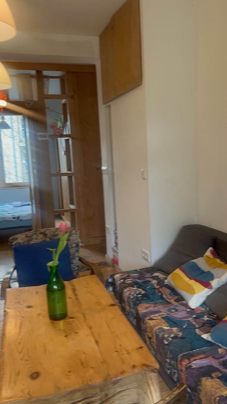 A second view across the wooden table in the Sofia apartment