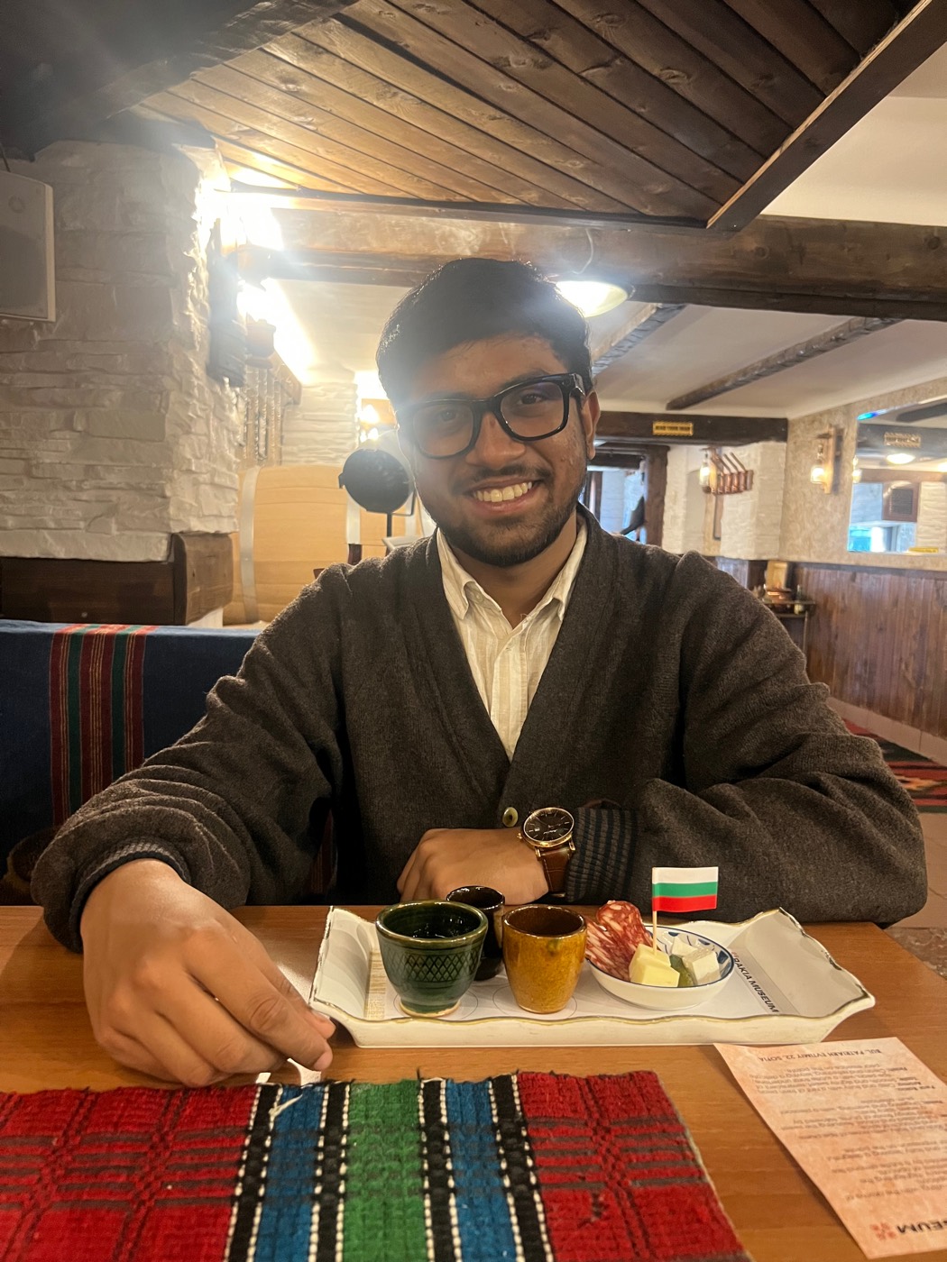 BhoumiK seated with the Rakia Museum tasting tray